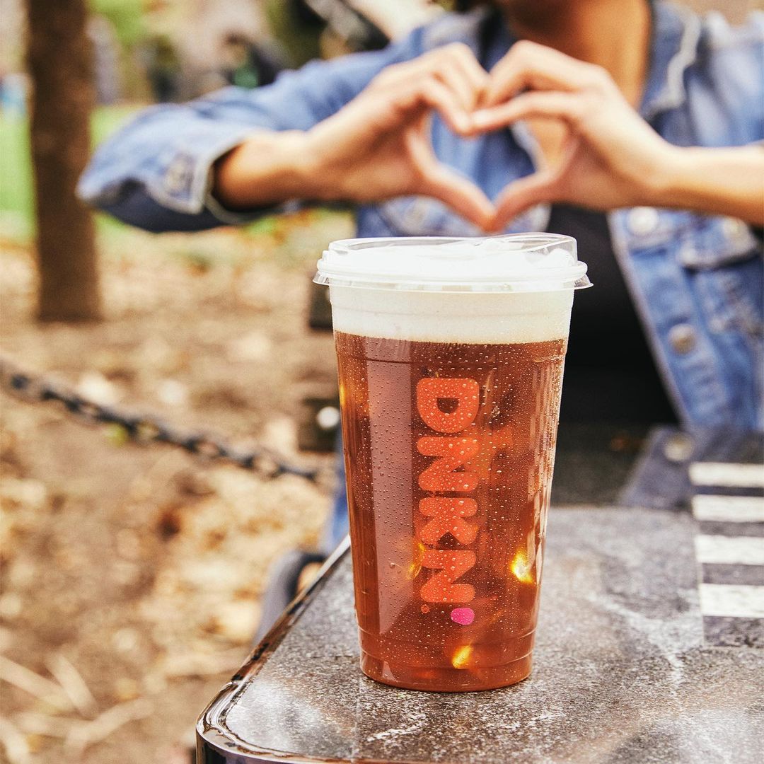 cup of dunkin donuts cold brew on outdoor table