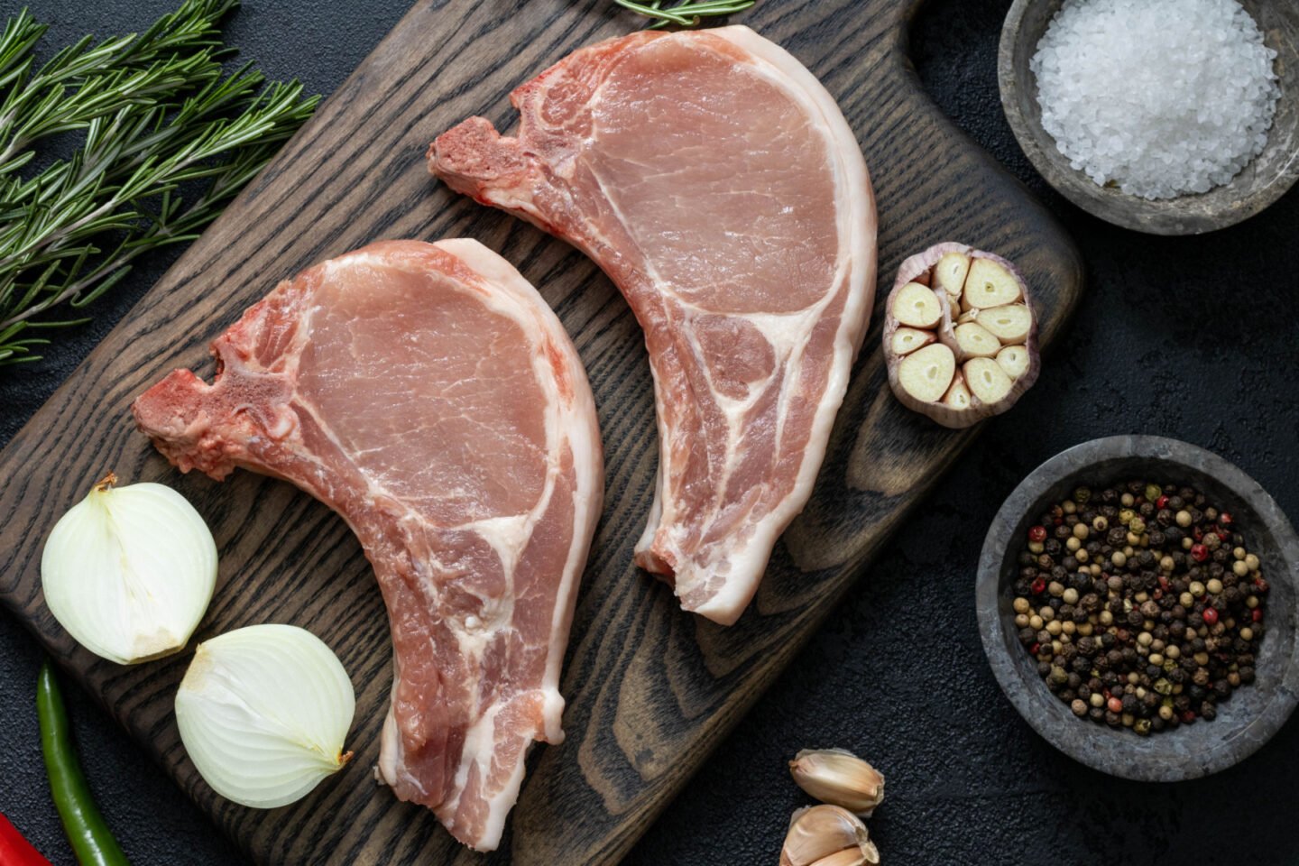 fresh steaks on a cutting board