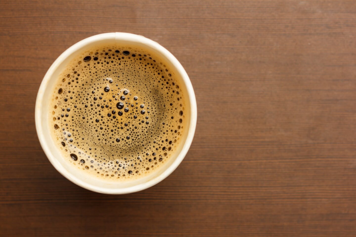 Top,View,Of,A,Paper,Cup,Of,Black,Coffee,On