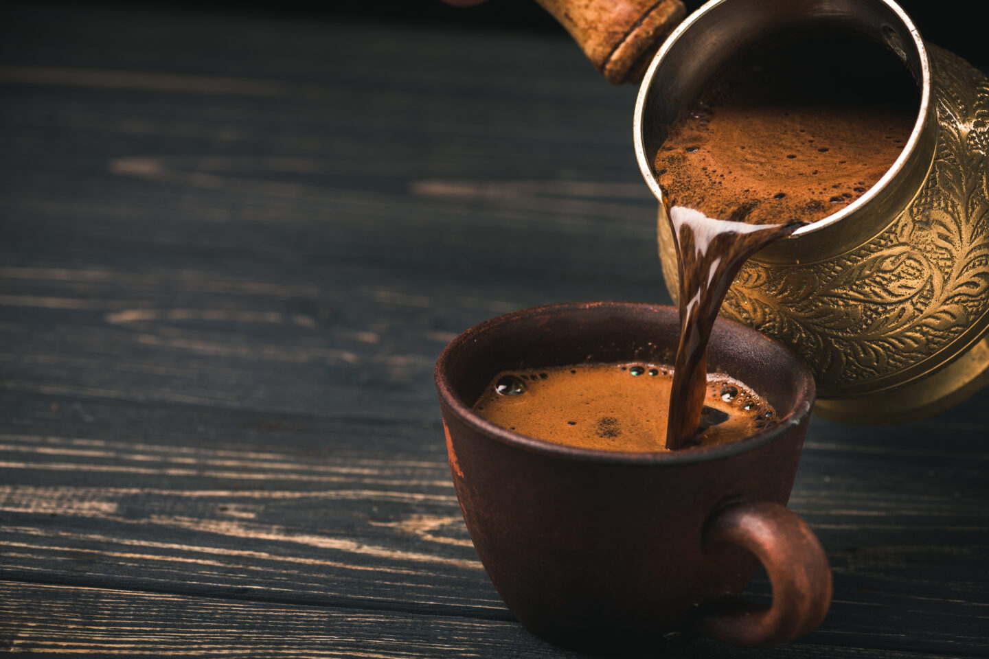 Pouring,Turkish,Coffee,Into,Vintage,Cup,On,Wooden,Background