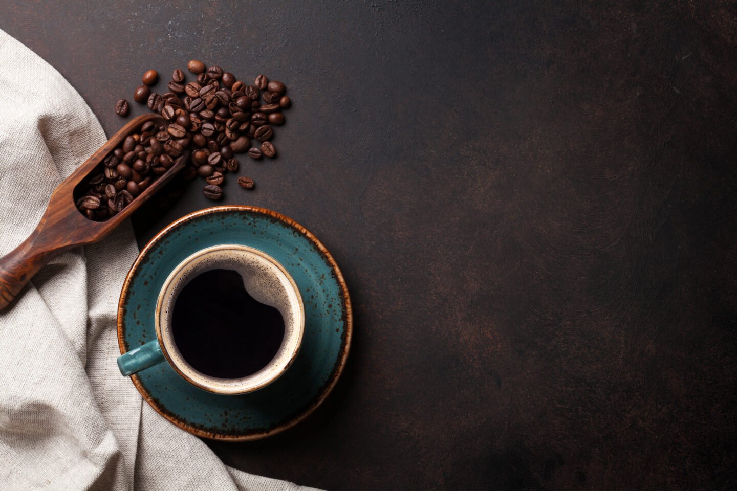 Coffee,Cup,And,Beans,On,Old,Kitchen,Table.,Top,View