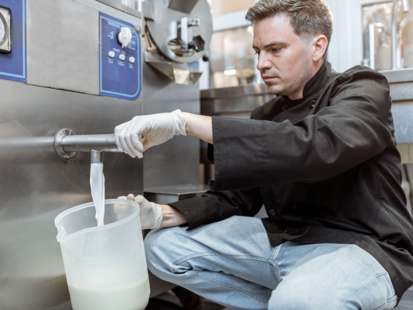 man fills up jug with pasteurized milk