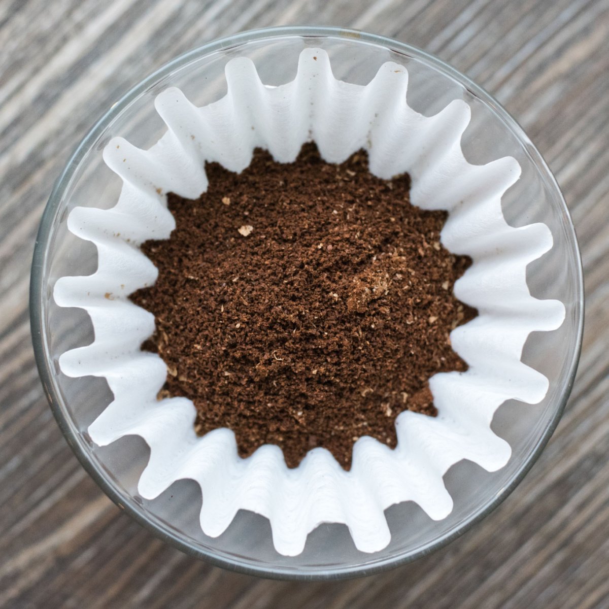 paper coffee filter filled with coffee grounds