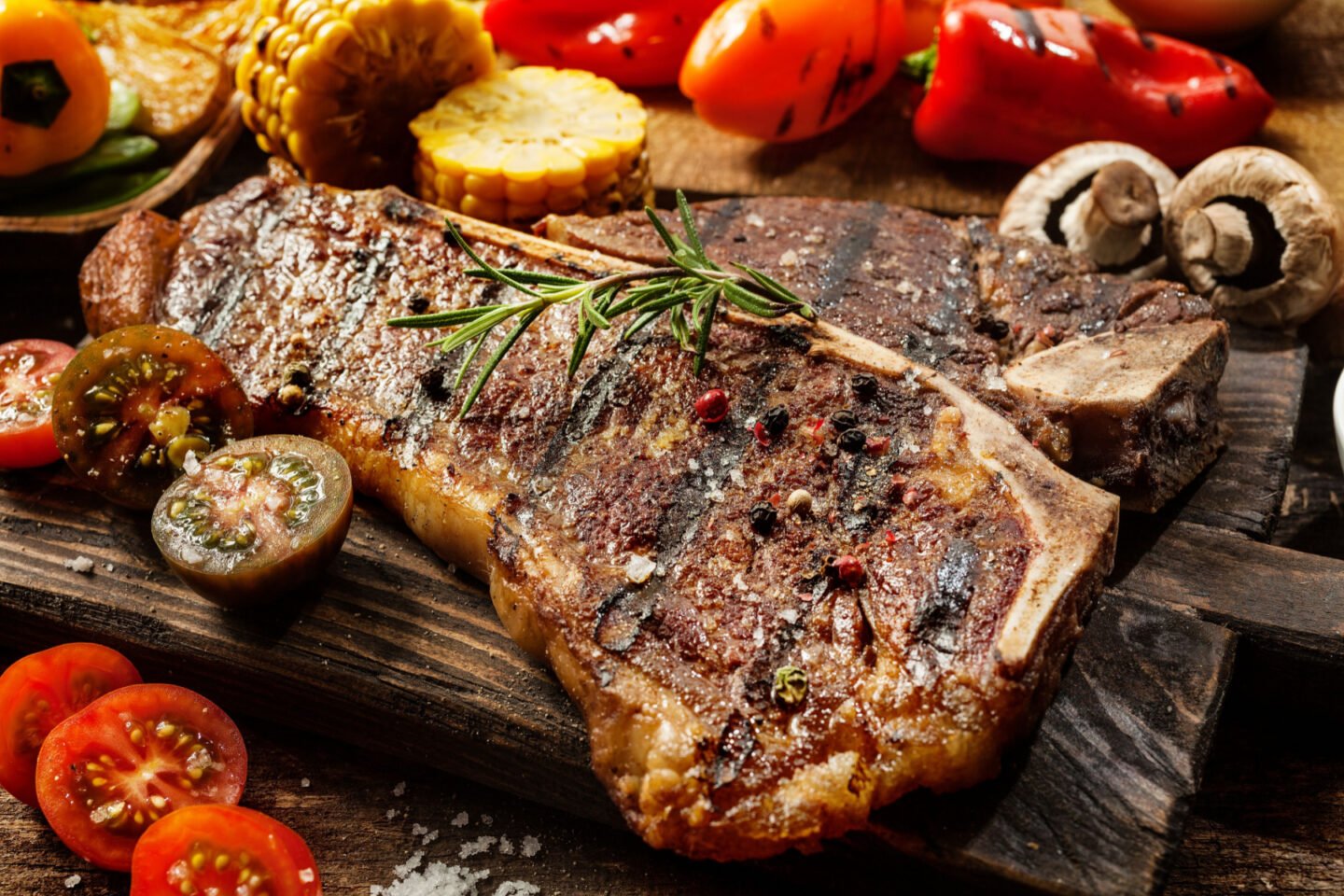 porterhouse steak with roasted veggies and rosemary