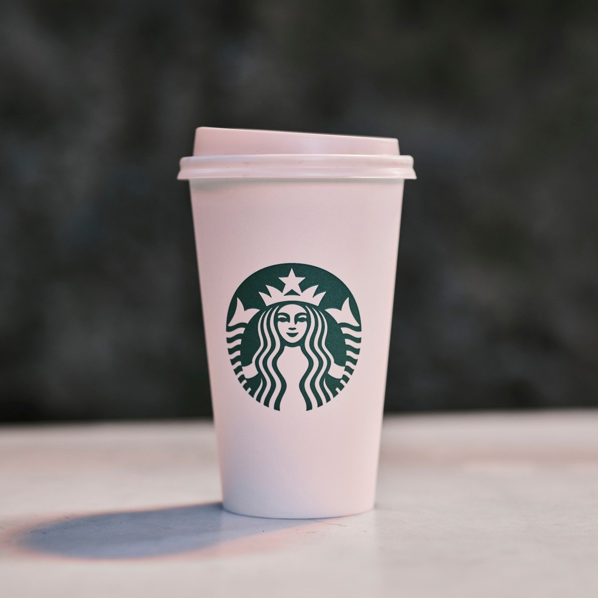 starbucks paper takeaway cup on surface