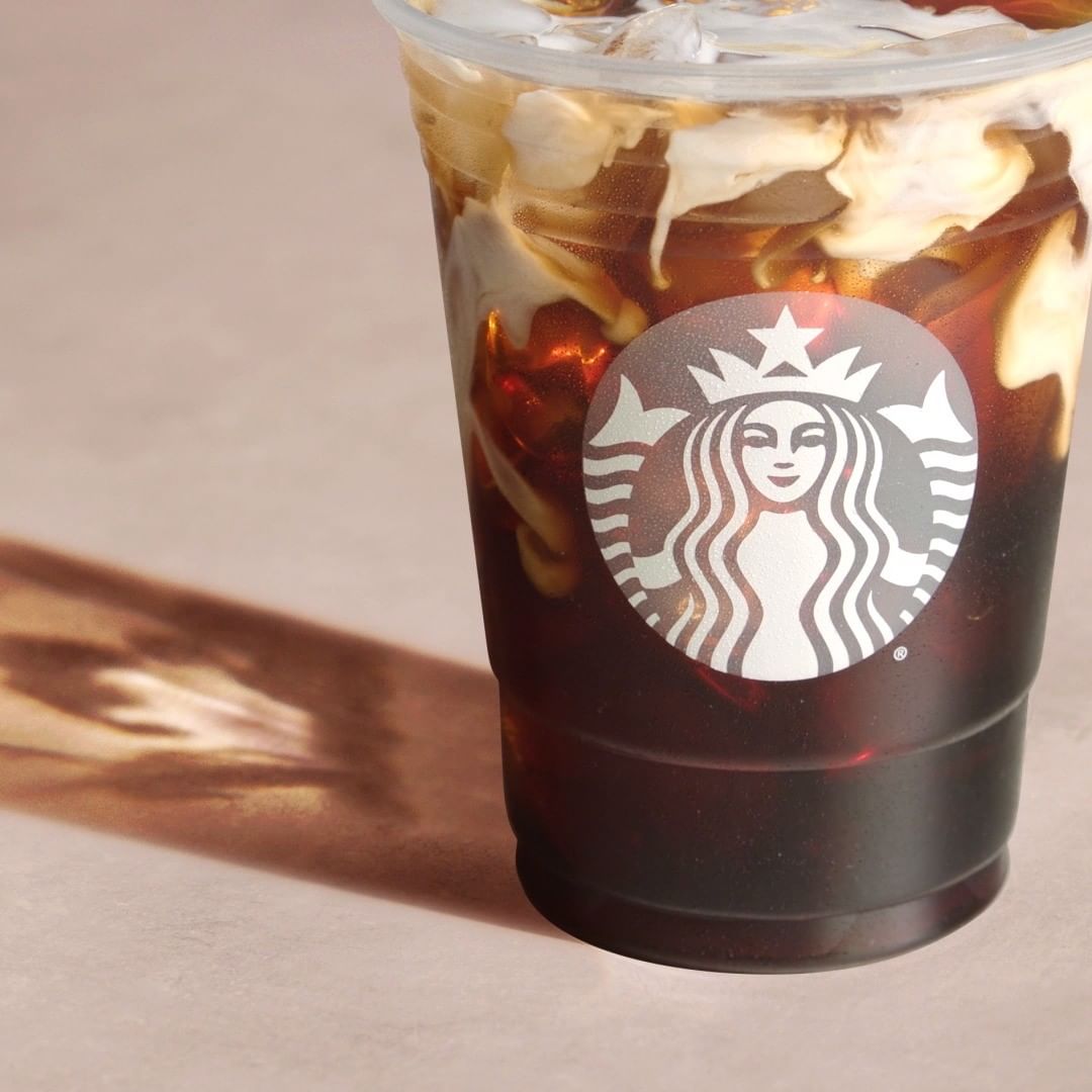 sweet cream flowing down cup of starbucks vanilla sweet cream cold brew