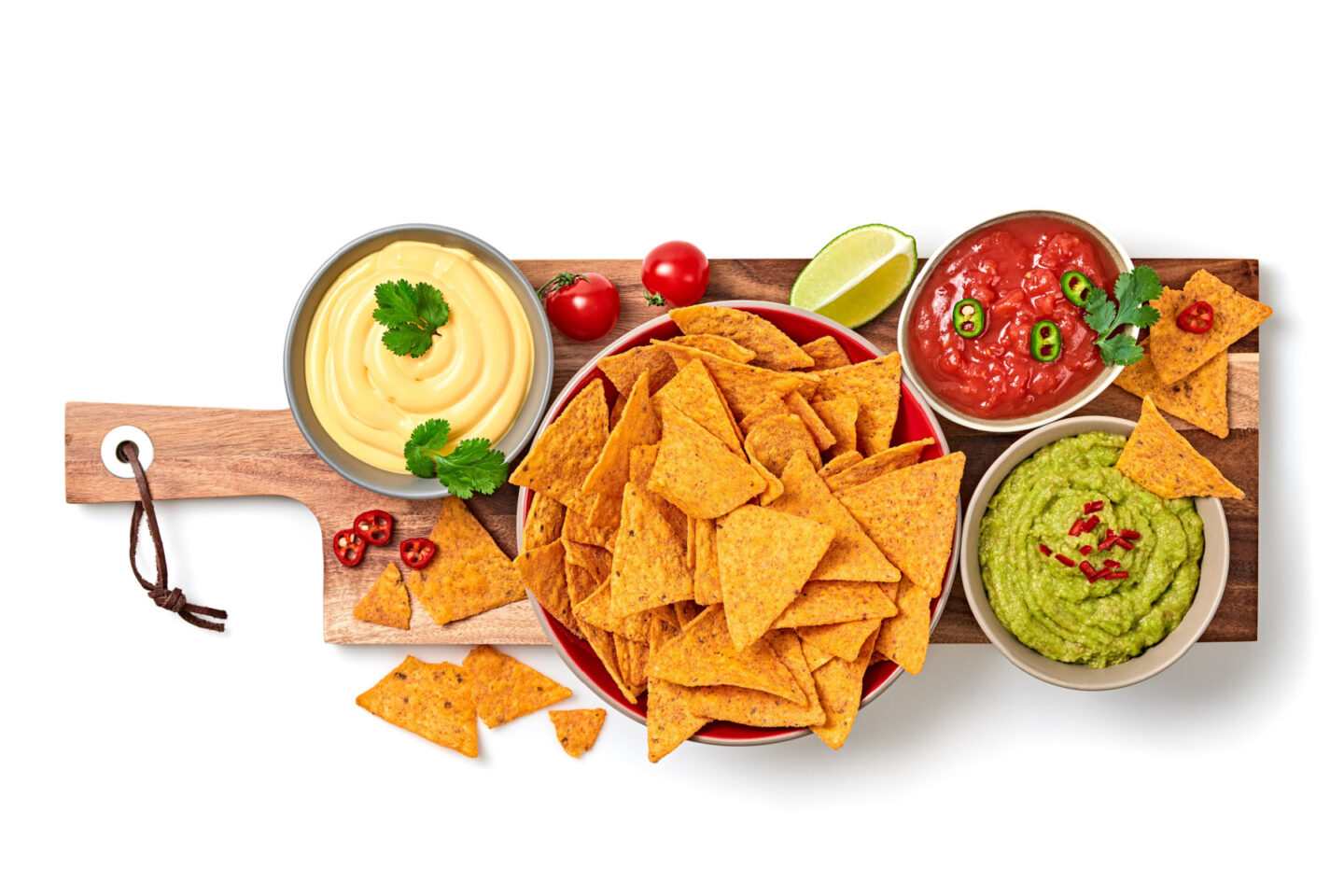 bowl of nachos with different dips
