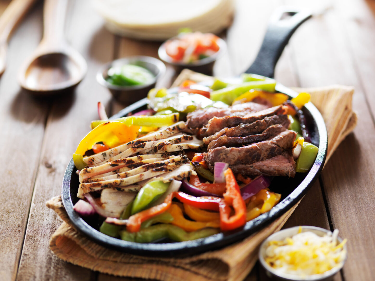 chicken and steak mexican fajitas