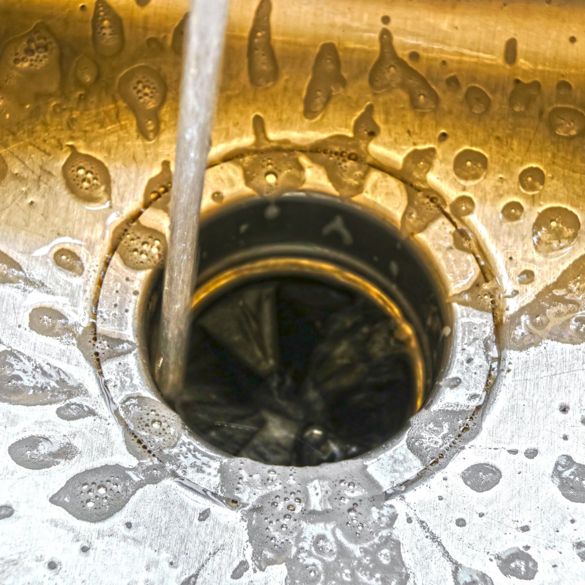 cleaning a kitchen sink garbage disposal