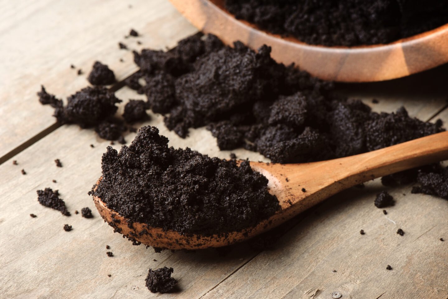 Closeup,Detail,Of,Coffee,Ground,In,Wooden,Spoon