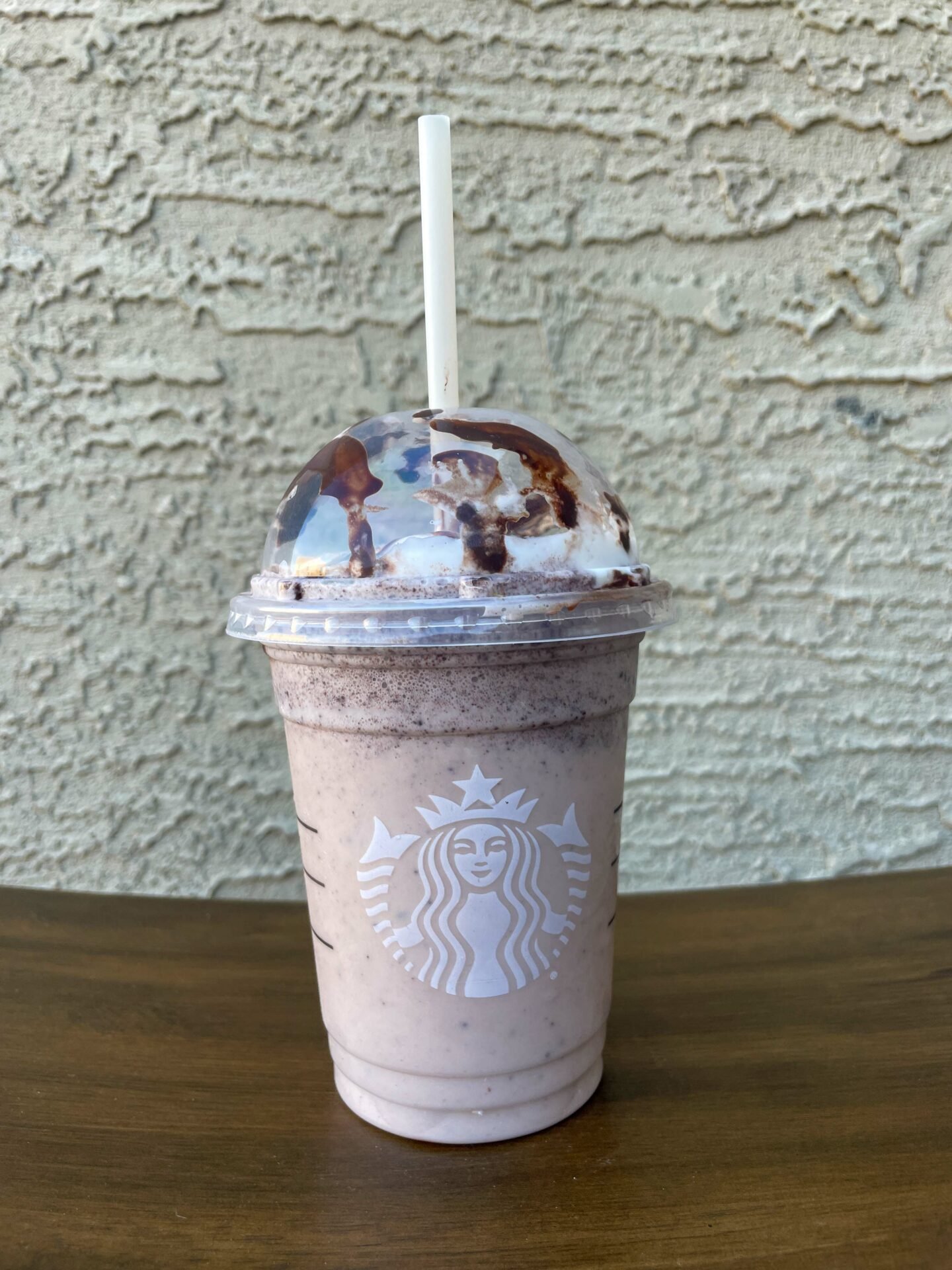 cup of oreo frappuccino starbucks secret menu drink on wooden table