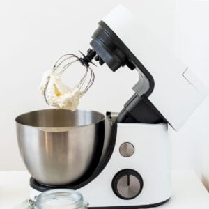 making whipped cream at home using mixer and stainless bowl