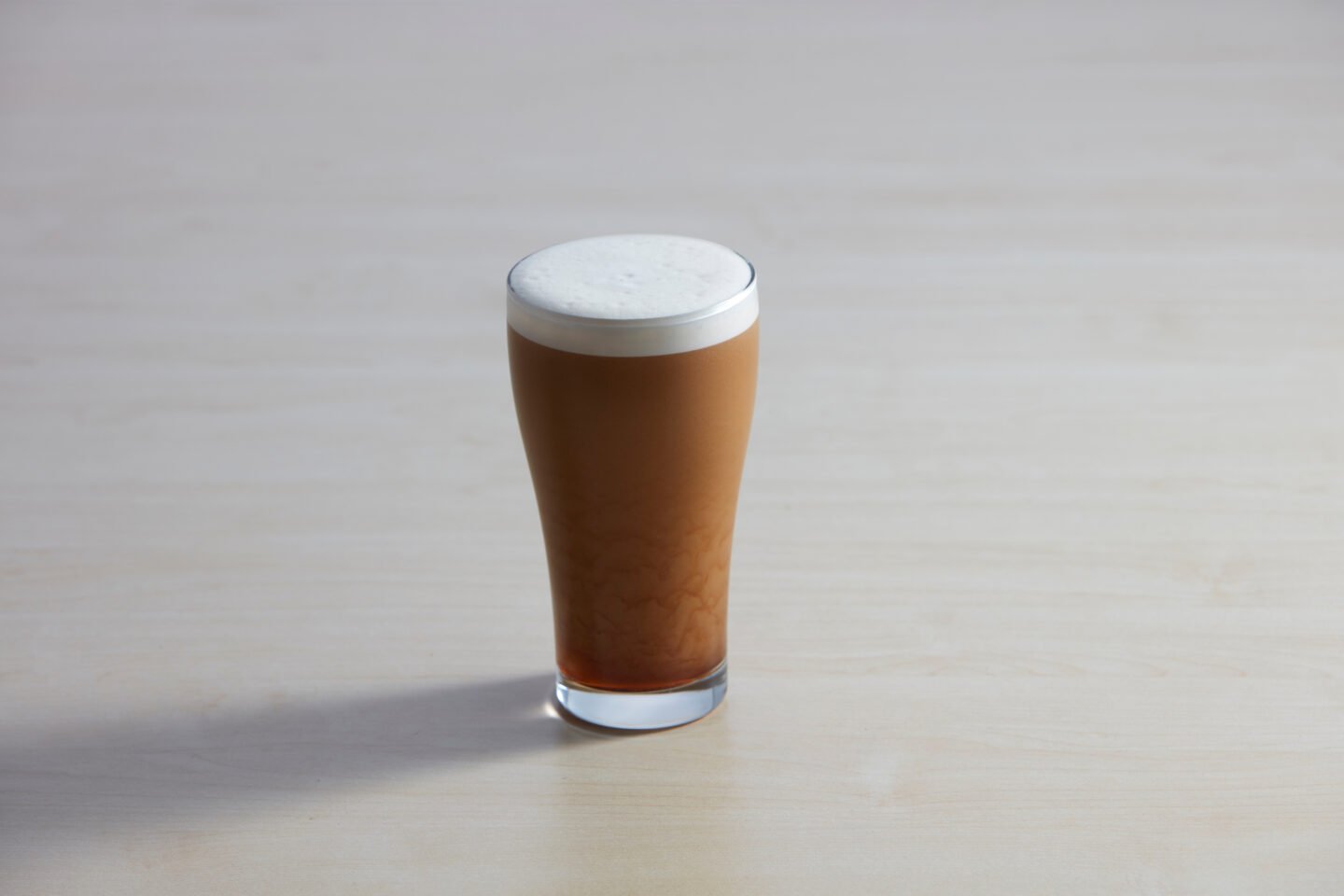 Nitro,Cold,Brew,Coffee,Glass,On,Wooden,Table.,Closeup,Of