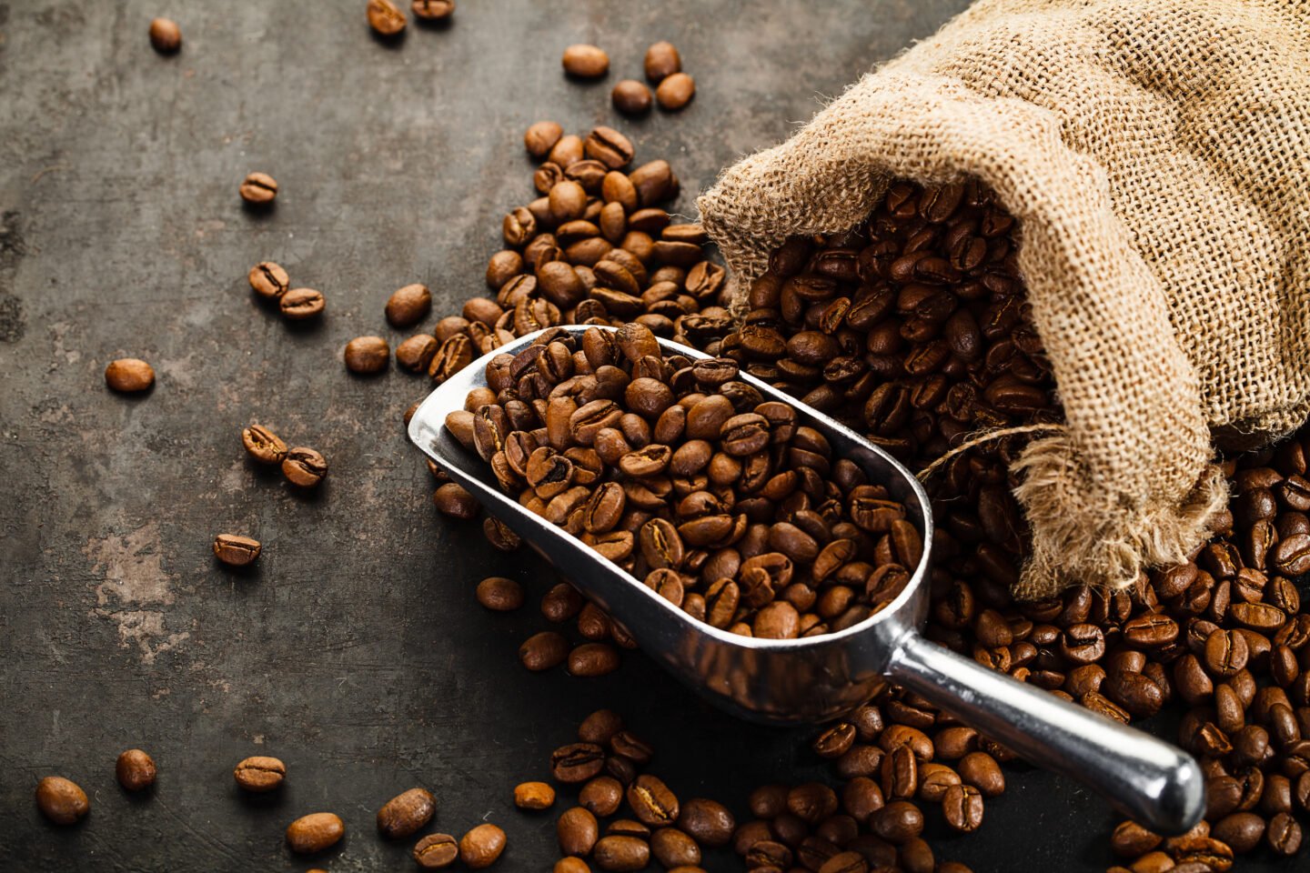 Cup,Of,Coffee,,Bag,And,Scoop,On,Old,Rusty,Background