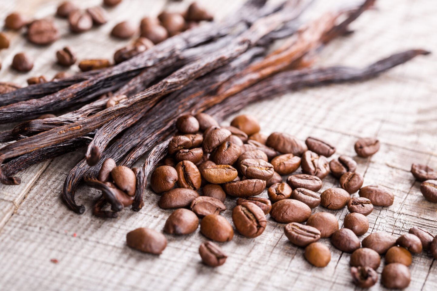 Vanilla,Pods,And,Coffee,Beans,On,Wooden,Background