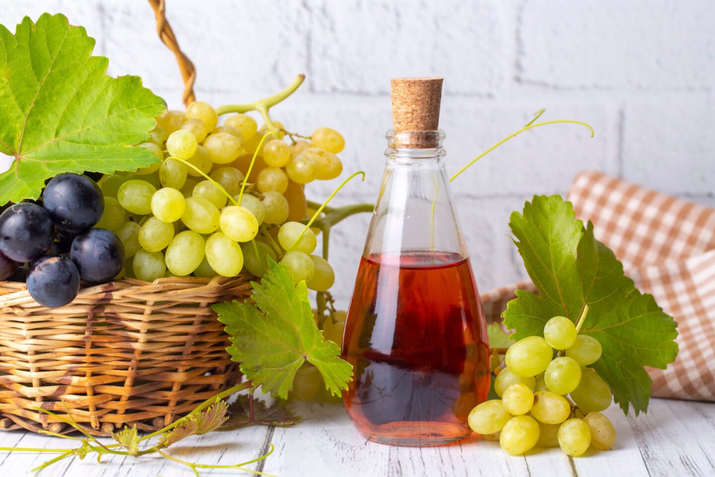 wine vinegar with baskets of grapes