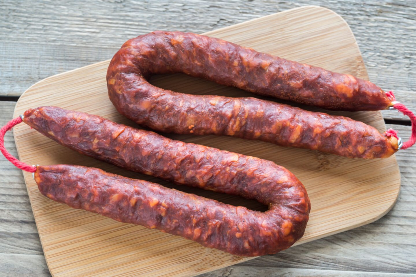 Spanish chorizos on wooden board