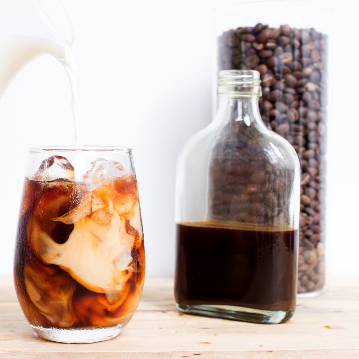 a-glass-of-coffee-with-a-bottle-of-coffee-extract