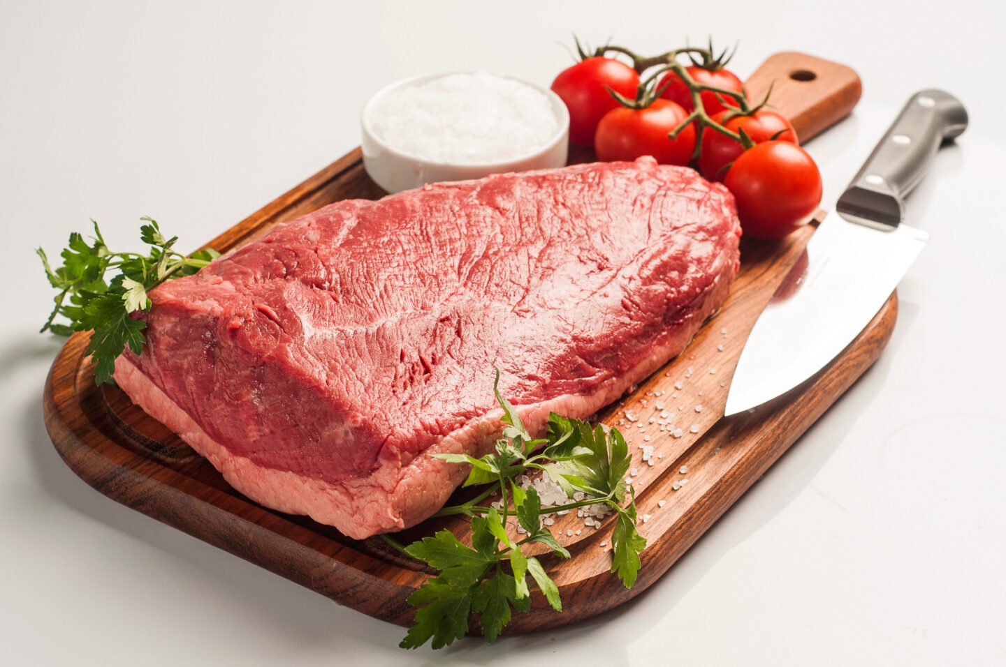 a-slab-of-top-sirloin-on-a-chopping-board