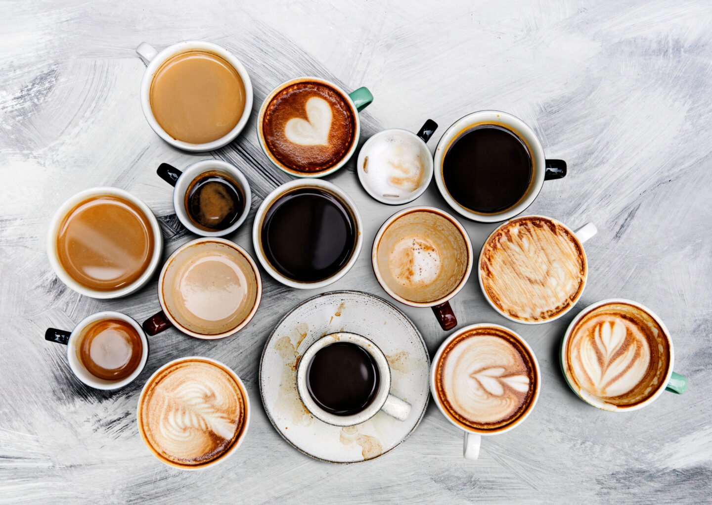 assorted-coffee-cups-on-a-textured-background