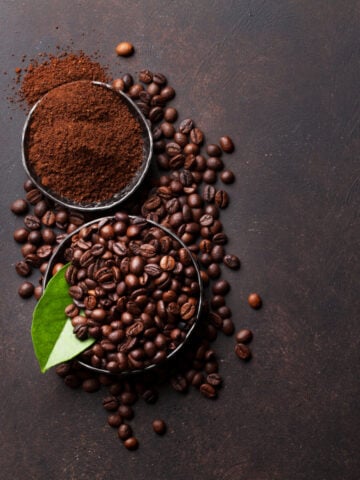 Coffee Beans And Ground Powder On Stone Background 360x480