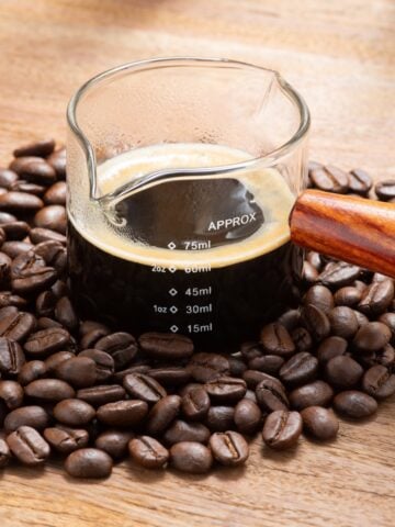 Espresso Coffee In A Wooden Handle Measuring Cup 360x480