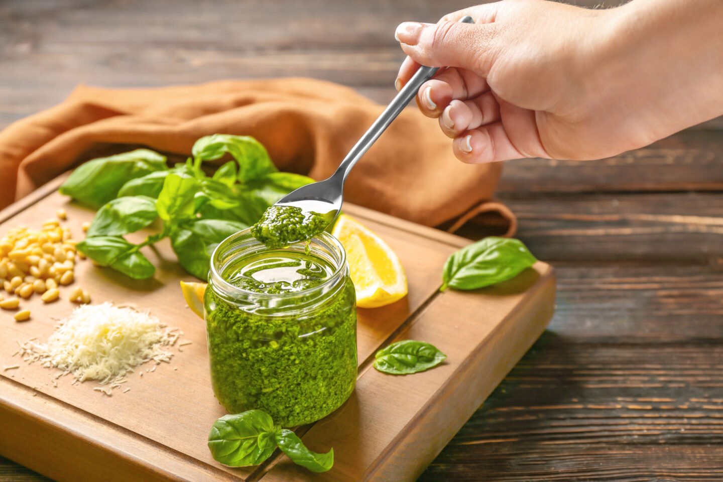 jar of pesto with ingredients