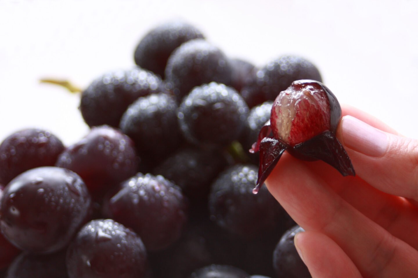 peeling the skin of grapes