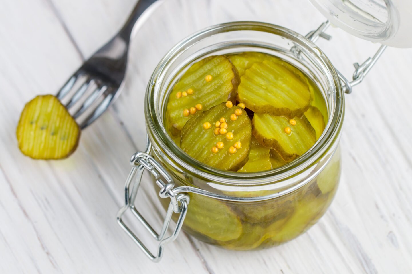 pickled cucumbers in a jar