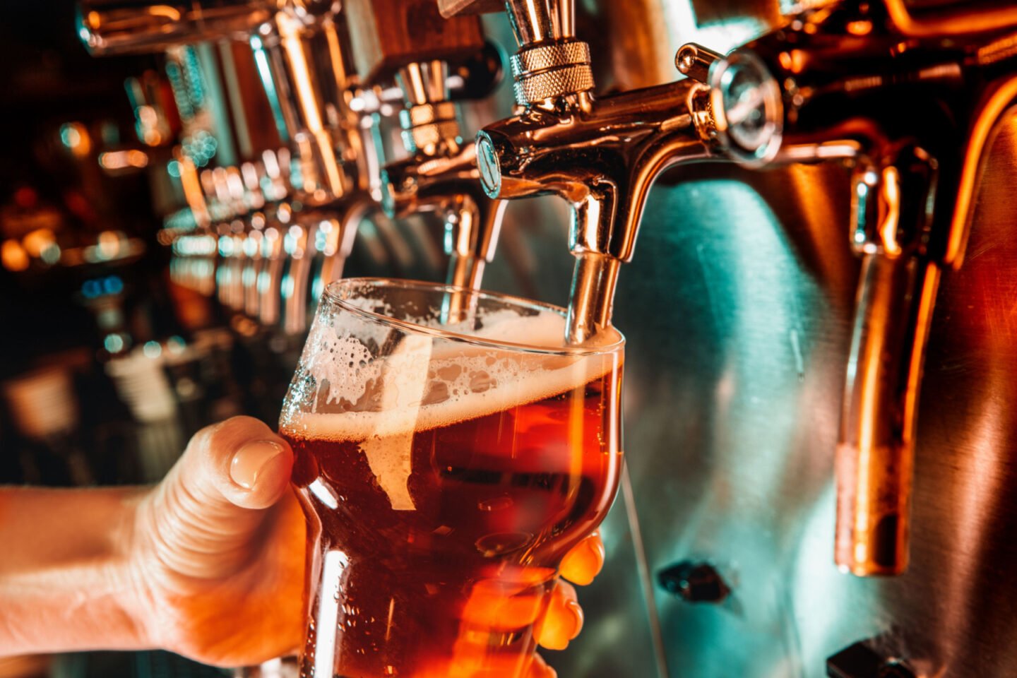 pouring lager beer from tap