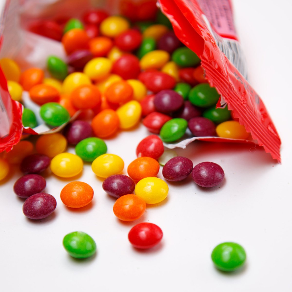 skittles spilling out of the pack