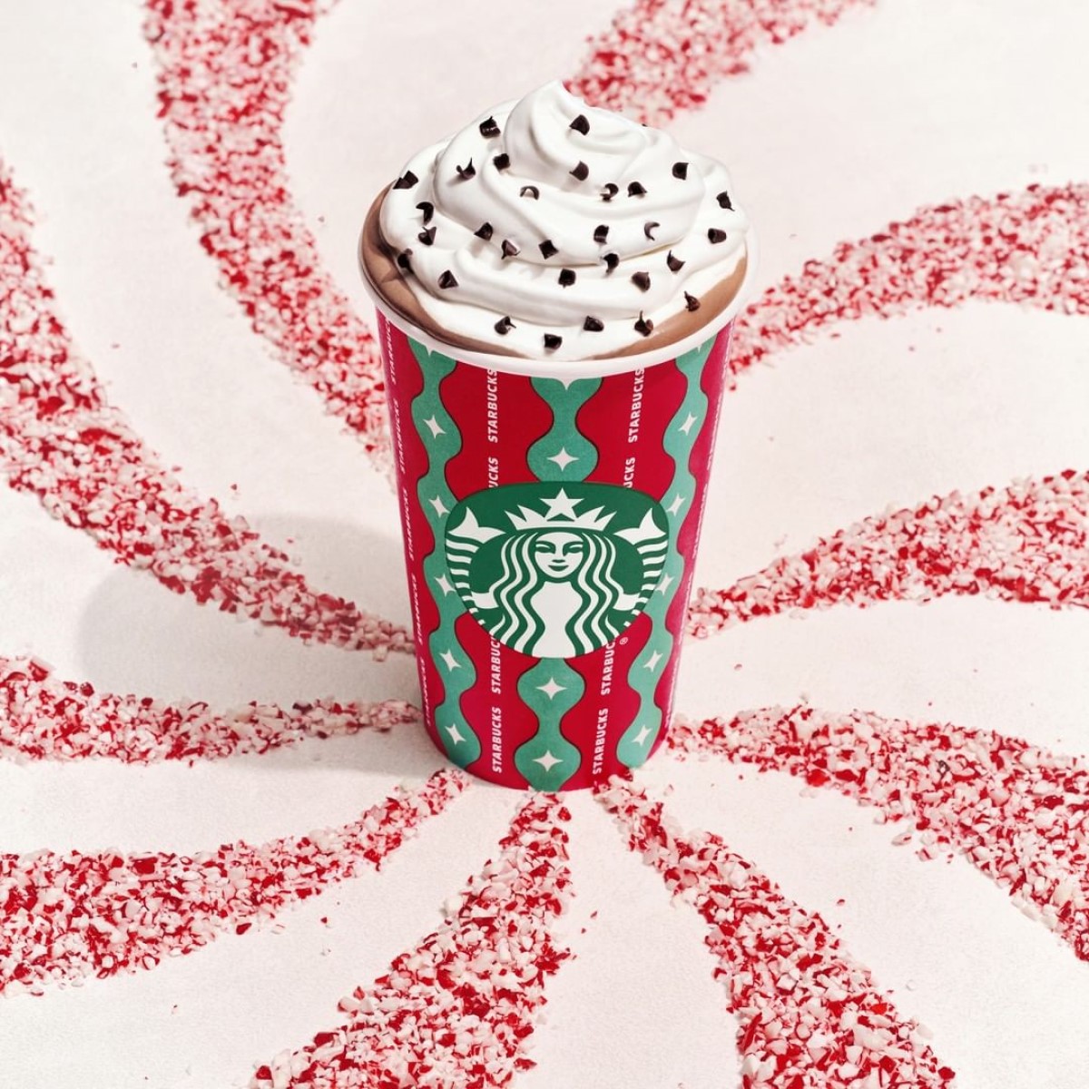 starbucks peppermint mocha in red holiday cup topped with java chips