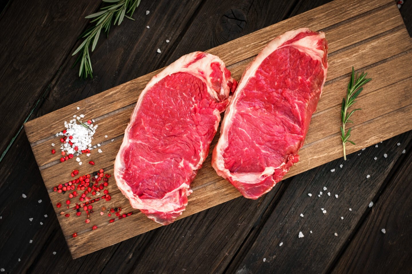 two-pieces-of-sirloin-cut-meat-on-a-chopping-board