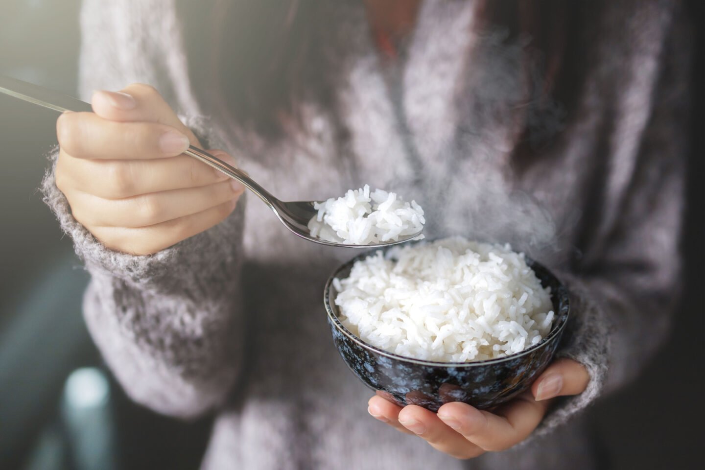 woman eating rice