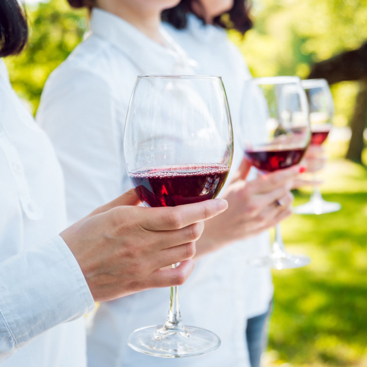women drinking wine outdoors