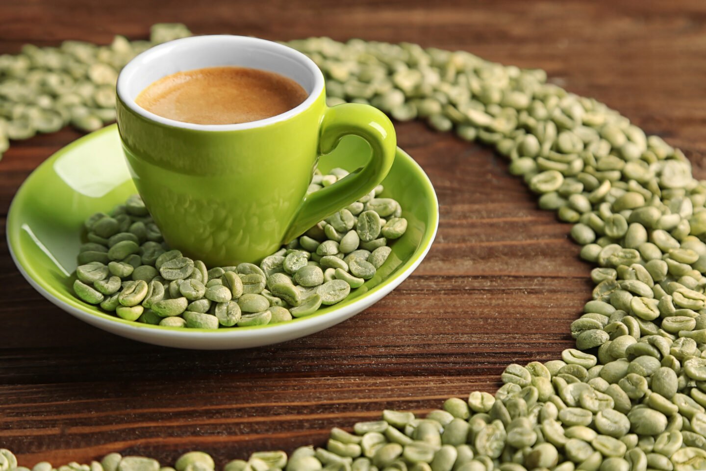 a-cup-of-coffee-with-green-coffee-beans-on-a-wooden-table