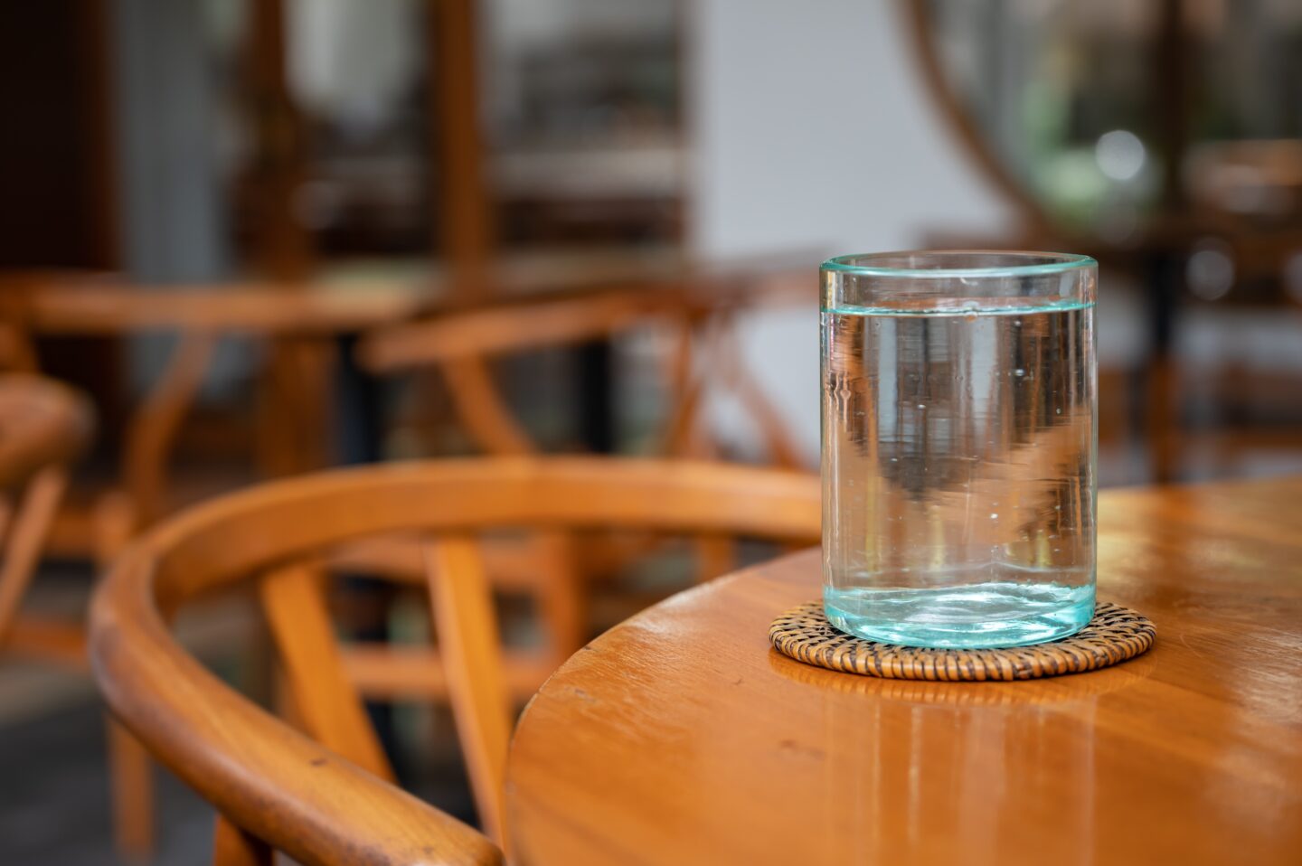 a-glass-of-water-on-a-wooden-table