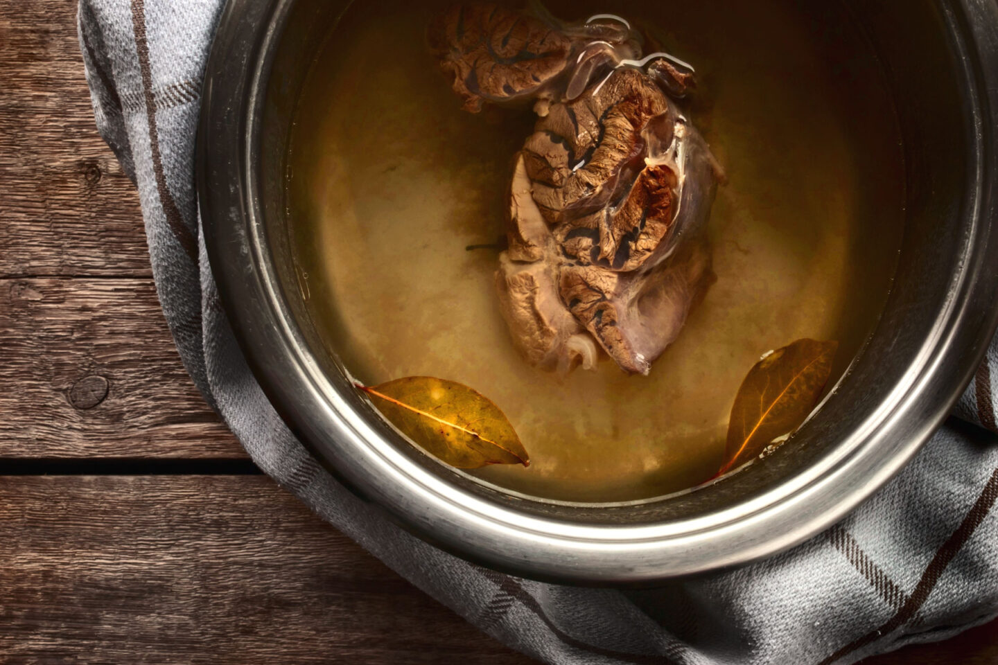 beef broth in a metal pot