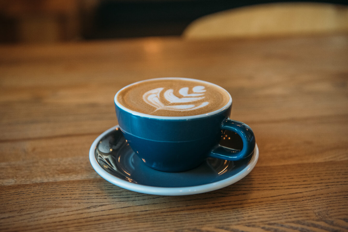 cappuccino-on-a-wooden-table-in-a-cafe