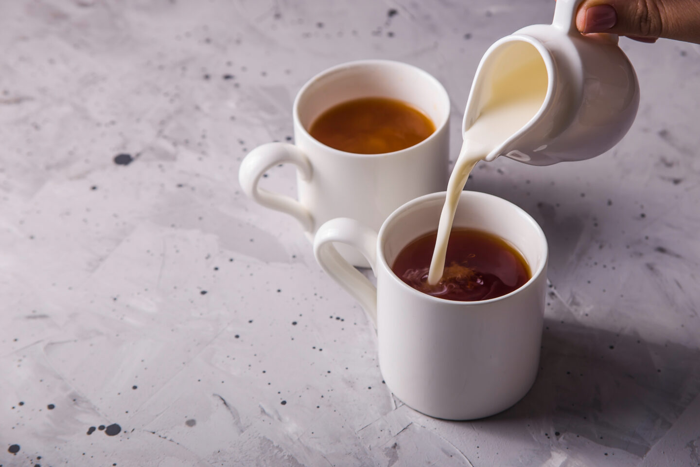 creamer-being-poured-to-a-cup-of-coffee