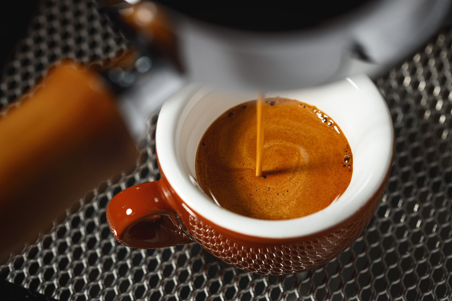 espresso-machine-pouring-coffee-to-a-brown-mug