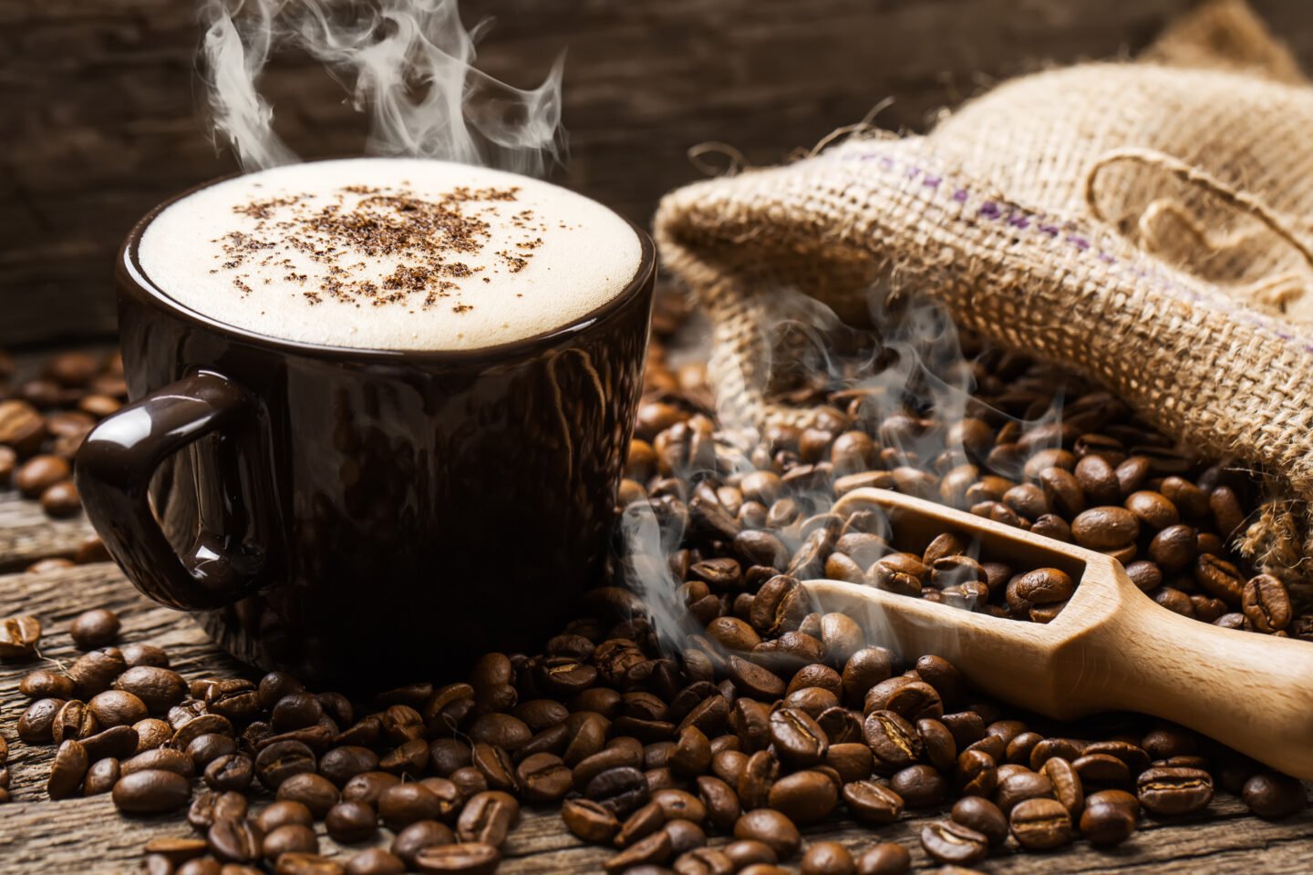 hot-coffee-and-coffee-beans-on-the-background