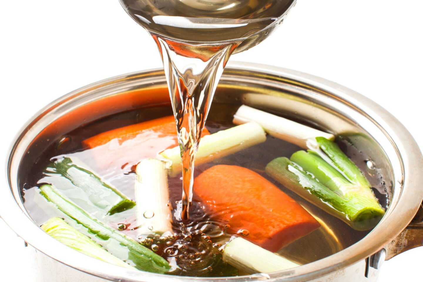 pouring water into stock pot