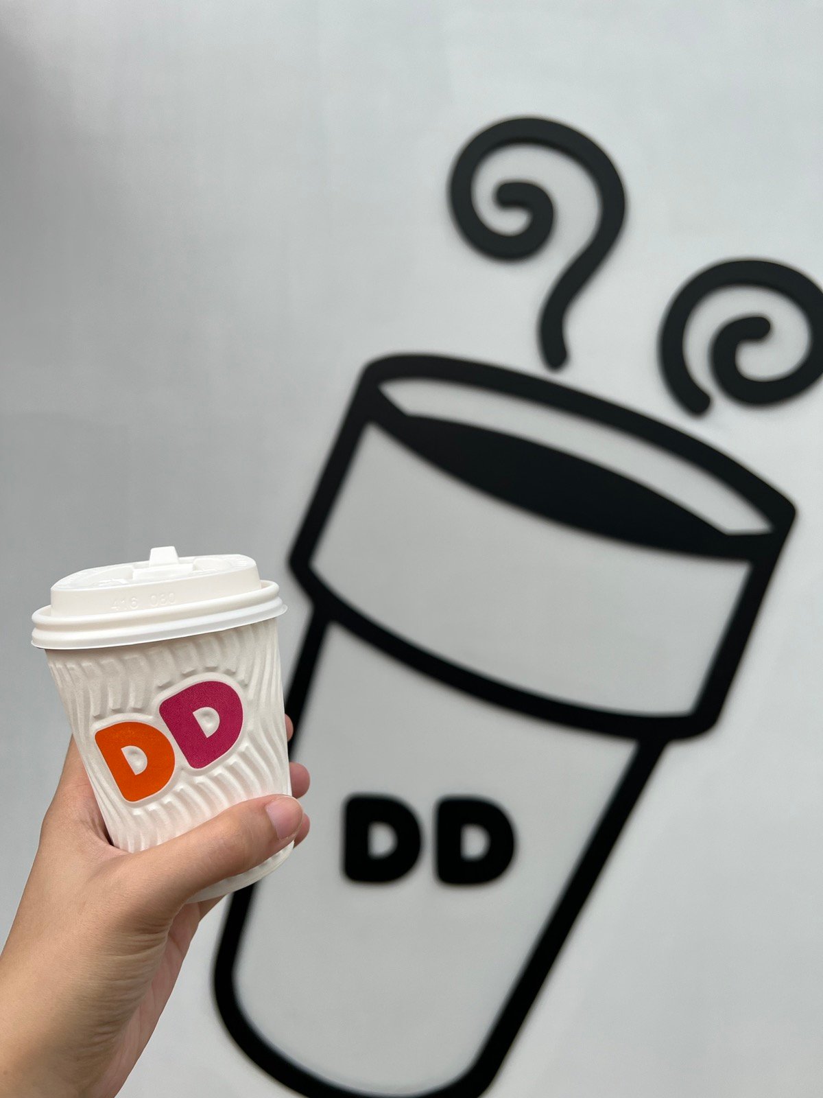 small cup of dunkin hot coffee