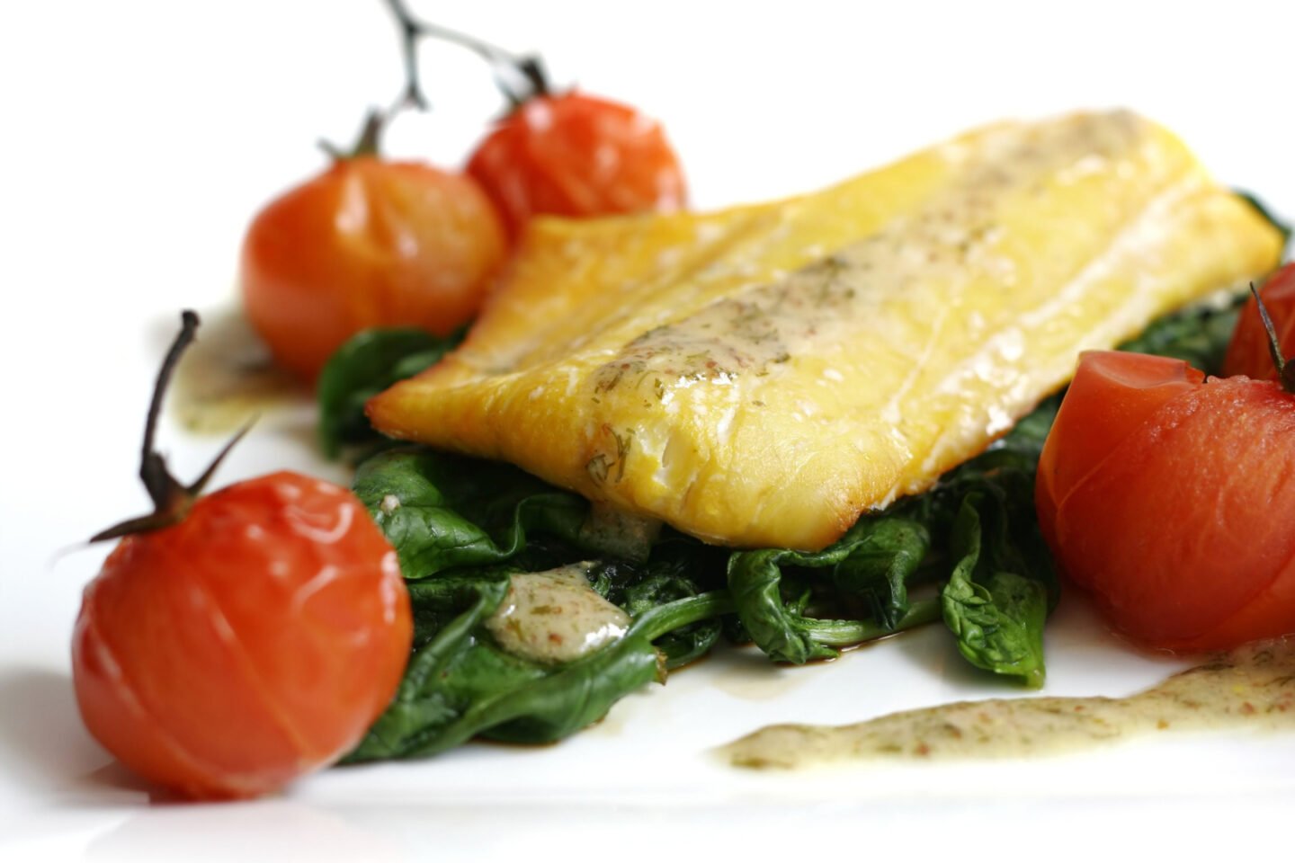 smoked haddock filet with spinach and tomatoes