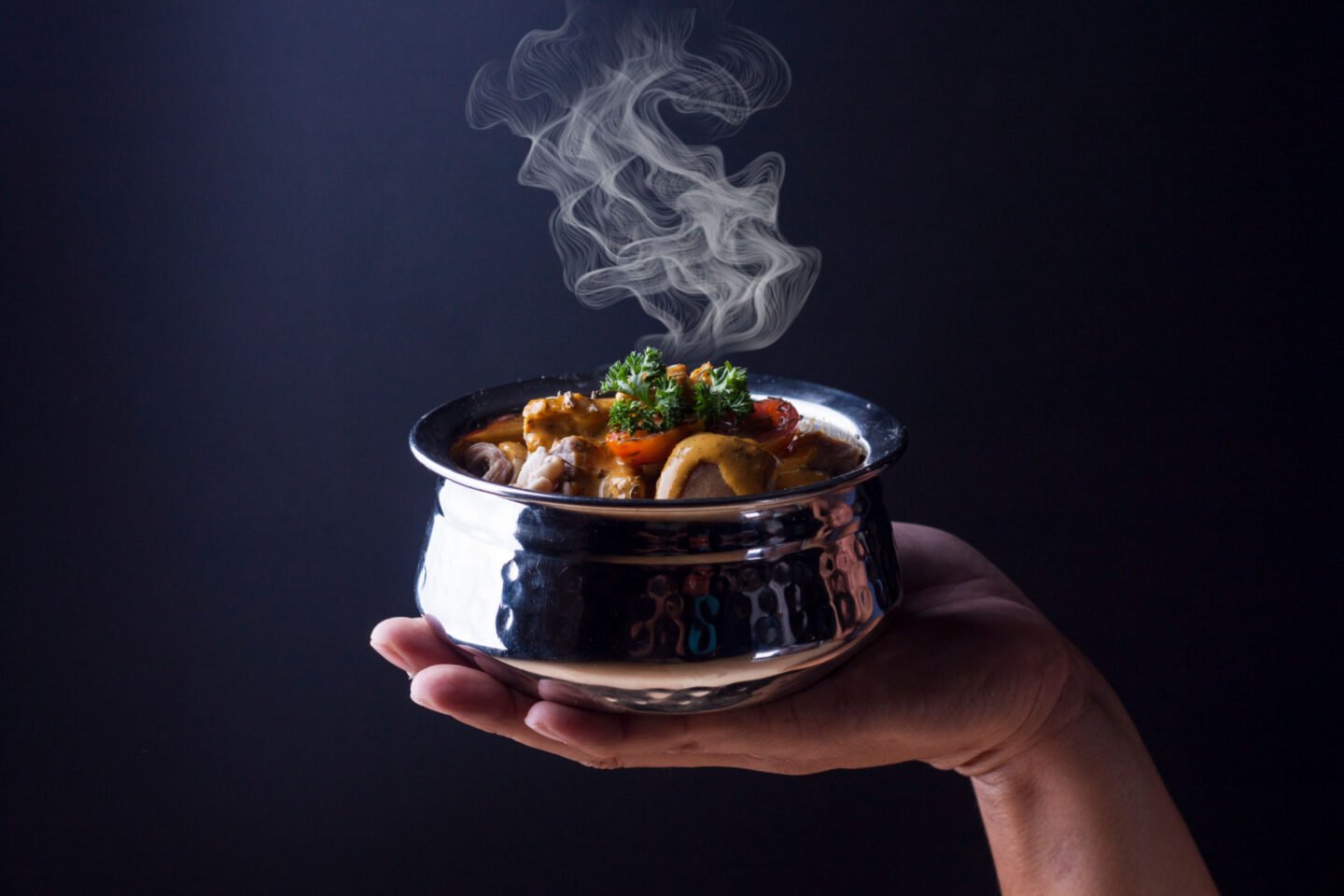 steaming bowl of goat curry