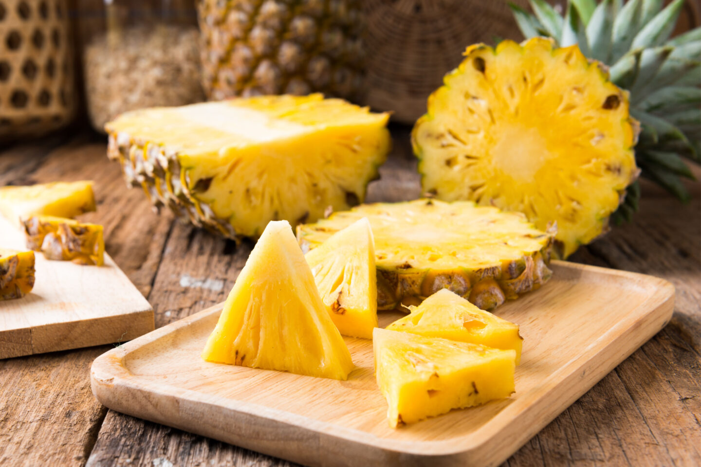 fresh pineapple slices on a wooden board