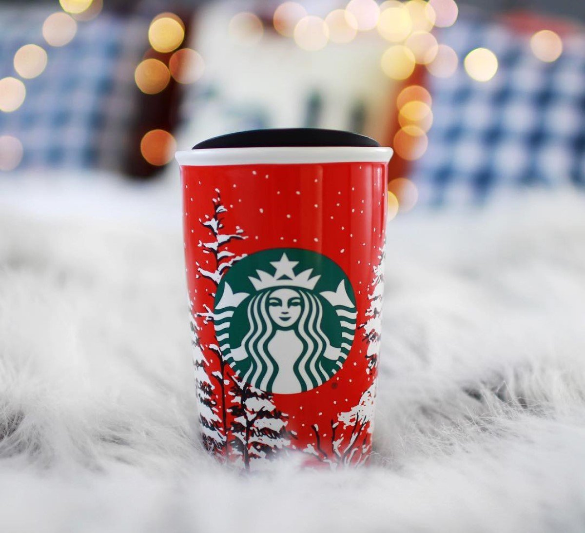 starbucks peppermint mocha latte in red cup on white fur