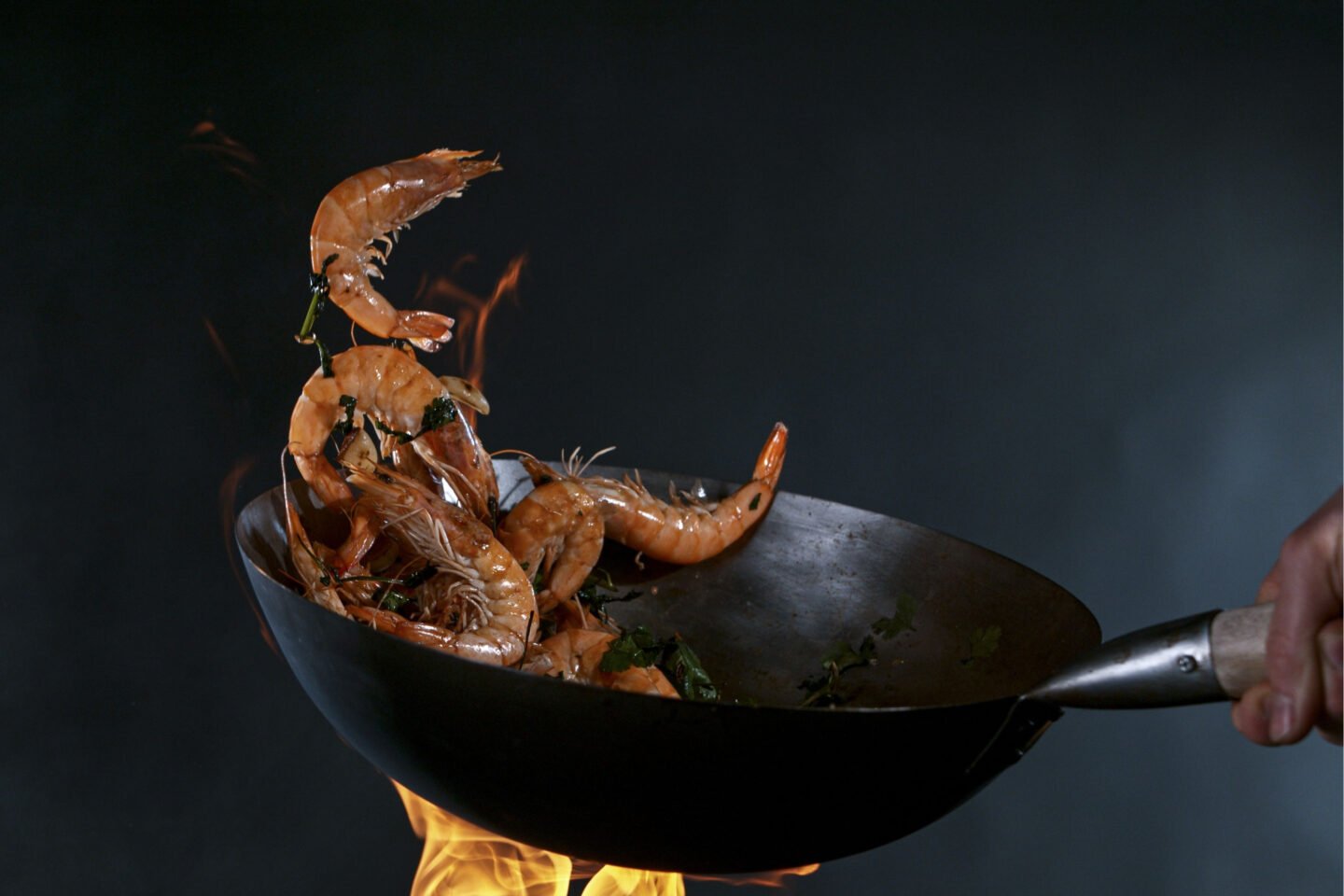 stir fried prawns in a wok