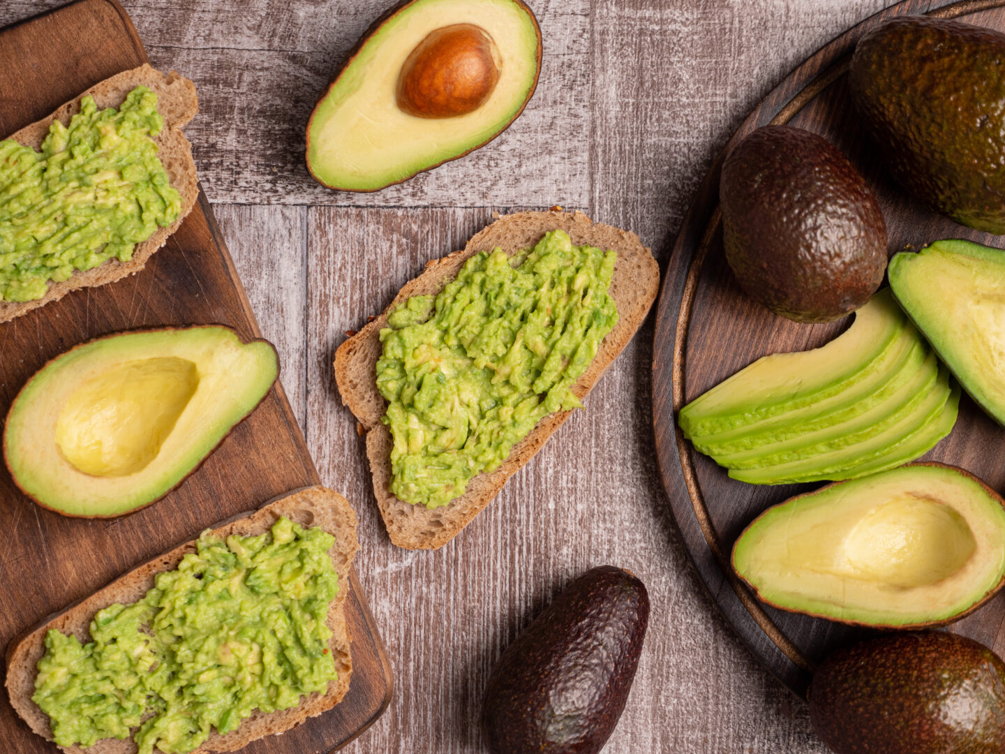 Healthy sandwiches made with avocado on a wooden board